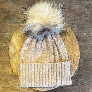 Cable knit hats with fur poms