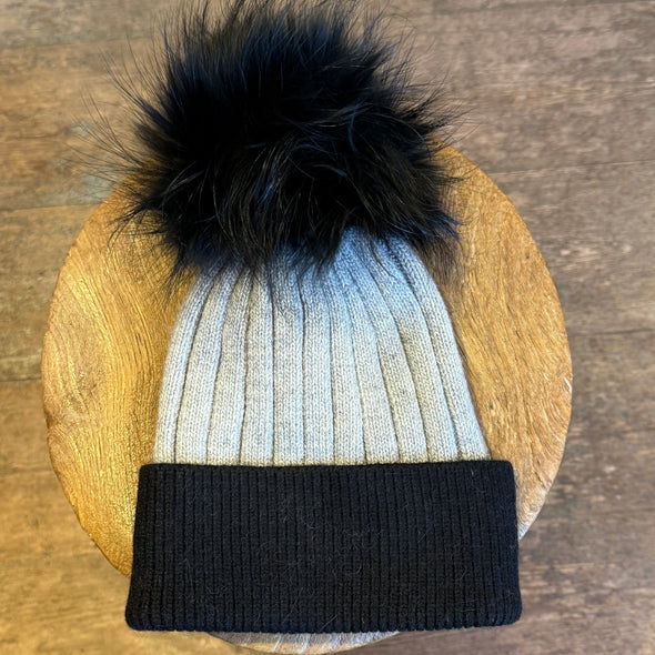 Cable knit hats with fur poms