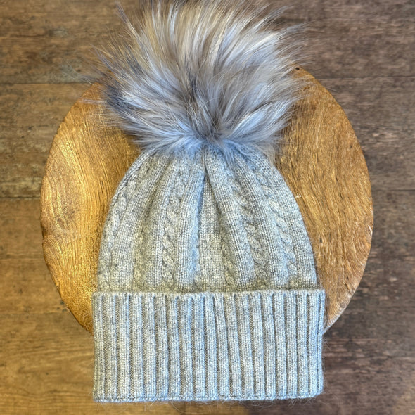 Cable knit hats with fur poms