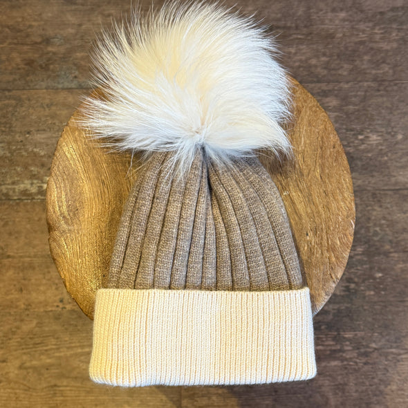 Cable knit hats with fur poms